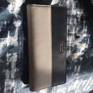Kate Spade and white wallet.